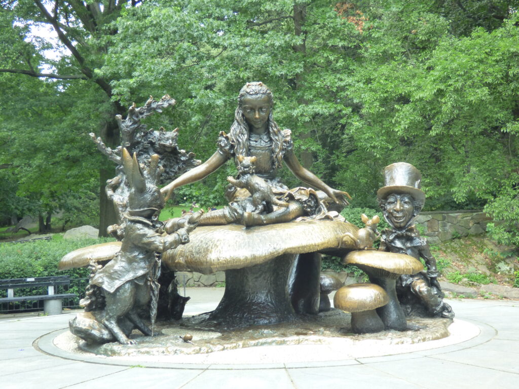 Alice à la table du Chapelier fou et la Lièvre de Mars